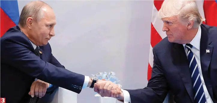  ??  ?? Don’t try anything: The pair lock eyes during the intense handshake, with Mr Trump abandoning the somewhat forceful technique he has used on other world leaders