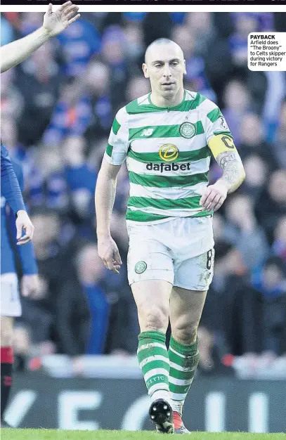  ??  ?? PAYBACK Arfield does “The Broony” to Celts skipper during victory for Rangers