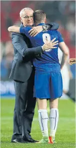 ??  ?? Ranieri hugs Jamie Vardy after the match against Sevilla.