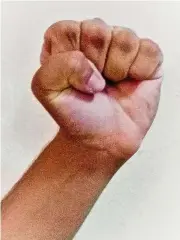 ??  ?? Make a fist: To start, make a tight fist, with the thumb outside. Hold for five seconds, then stretch out all the fingers for another five seconds. — Photos: REVATHI MURUGAPPAN/The Star