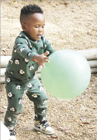  ?? Brodie Johnson • Times-Herald ?? Josiah Palmer, 2, is dressed warmly in his sweatsuit as he plays with a ball on the playground at Teach and Tend Daycare. Cooler weather is allowing area children to spend more time playing outside.