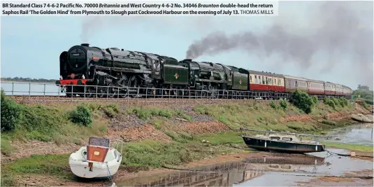  ?? ?? BR Standard Class 7 4-6-2 Pacific No. 70000 Britannia and West Country 4-6-2 No. 34046 Braunton double-head the return Saphos Rail ‘The Golden Hind’ from Plymouth to Slough past Cockwood Harbour on the evening of July 13. THOMAS MILLS