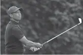  ?? KELVIN KUO/USA TODAY SPORTS ?? Tiger Woods tees off on the 18th hole during the third round of the Zozo Championsh­ip on Saturday at Sherwood Country Club. Woods shot rounds of 76-66-71-74 and finished 22 shots behind winner Patrick Cantlay.