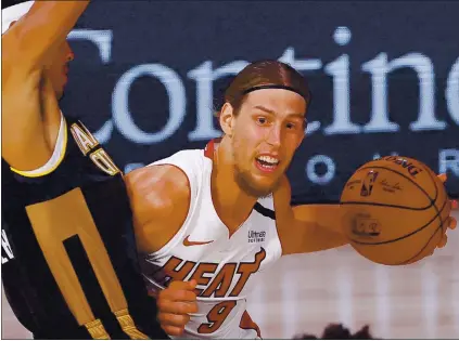  ?? KEVIN C. COX — GETTY IMAGES ?? Miami might be looking to rid itself of Kelly Olynyk and his $13.6 million contract for the 2021 season, which should interest Golden State.