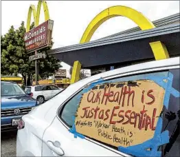  ?? DAMIAN DOVARGANES AP ?? Companies such as McDonald’s are being pressed on issues such as paid sick leave for their workers during the COVID-19 outbreak.