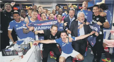  ??  ?? VICTORY Pompey’s squad celebrate the League Two title following a 6-1 win over Cheltenham in May 2017.