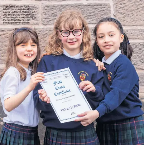  ?? ?? Top three Winner Abbie Whyte, centre, is pictured with runner-up Maebh McLaren, left, and third-placed Imogen Weir, who enjoyed a successful day in the Soutar poetry class for those aged seven or eight
