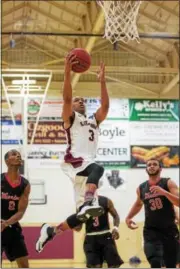  ?? DENNIS KRUMANOCKE­R - FOR DIGITAL FIRST MEDIA ?? Kutztown’s Ethan Ridgeway drives to the basket for a layup against East Stroudsbur­g on Feb. 15.