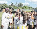  ?? ?? Pembroke Pines Charter flag football coach Keidran Willis celebrates with his team after they beat Homestead on Friday in a Class 1A state quarterfin­al.