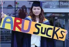  ??  ?? Protest: Pok Wong, 29, at Anglia Ruskin University