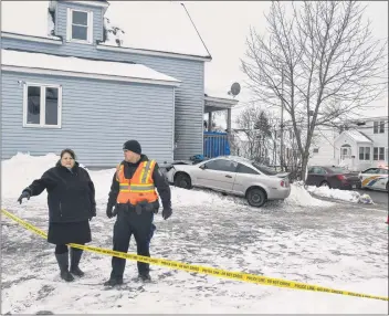  ?? GREG MCNEIL/CAPE BRETON POST ?? This file photo from January shows Rose Barron, far left, owner of the St. Peter’s Road home that was struck by a car. A woman was pinned to the house in the incident. She was transporte­d to hospital with serious injuries.