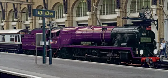  ?? JOHN TITLOW ?? How Bulleid West Country 4-6-2 No. 34027 Taw Valley might appear on the Severn Valley Railway for celebratio­ns to mark the Queen’s Platinum Jubilee. The picture was taken at King’s Cross on July 10, 2000, when Taw Valley was painted in bright red as the first ‘Hogwarts Castle.’ While we do not yet know exactly which shade of purple livery it will temporaril­y carry this summer or which fictitious name will be carried, a touch of Harry Potter wizardry on the computer hopefully gives readers a foretaste.