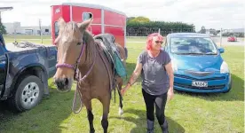  ?? Photos / Jimmy Ellingham ?? Juanita Preston and Jazzy get ready for the ride through Feilding to deliver the petition calling for more consultati­on with horse riders.