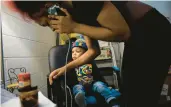  ?? VINCENT ALBAN/CHICAGO TRIBUNE ?? Joziah McAllister, 1, sits while his mother, Irmony Sneed, speaks on the phone, March 5 at the Blanche Foxworthy Infant Care Center in Harvey. The Thornton Township High School District 205 center is one of only two programs in Illinois that provide day care for the children of teen parents pursing their high school education.