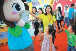  ?? PHOTOS BY ZOU HONG / CHINA DAILY ?? A wide range of activities at the Beijing Internatio­nal Book Fair drew the attention of young visitors. The annual fair, launched in 1986, has now grown into one of the world’s biggest book events.
