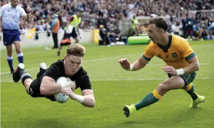  ?? Photograph: Mark Baker/AP ?? New Zealand’s Jordie Barrett scores the All Blacks’ second try in the second Bledisloe Test against the Wallabies at Eden Park.