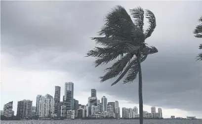  ?? JOE RAEDLE GETTY IMAGES ?? Isaias is piling another burden on Florida communitie­s already hard-hit by previous storms and the pandemic.