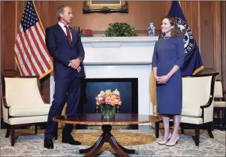  ?? Greg Nash / Associated Press ?? Supreme Court nominee Judge Amy Coney Barrett meets with Senate Majority Whip John Thune of South Dakota on Tuesday at the Capitol.