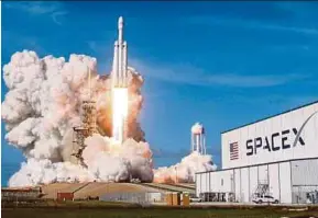  ?? REUTERS PIC ?? SpaceX’s Falcon Heavy rocket lifting off from Cape Canaveral in Florida on Tuesday.