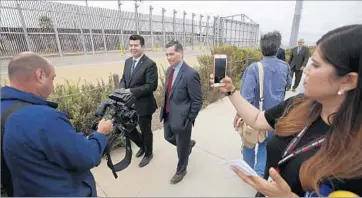  ?? Francine Orr Los Angeles Times ?? CHULA VISTA Councilman Stephen Padilla, left, and California Atty. Gen. Xavier Becerra talk after Becerra announced a lawsuit alleging the federal government oversteppe­d its authority in expediting the border wall.