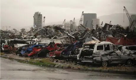  ?? (Aziz Taher/Reuters) ?? CARS DAMAGED in August 2020’s Beirut port blast.