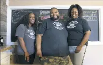  ?? STAFF PHOTO BY ALEXANDRIA SAURMAN ?? Tranice Watts, right, cofounder and business manager, Davie Feaster, co-founder and brew master, and Kendra Feaster, co-founder and marketing public relations director, pose for a picture at their new brewery in Waldorf.