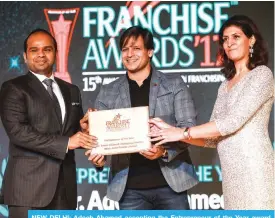  ??  ?? NEW DELHI: Adeeb Ahamed accepting the Entreprene­ur of the Year award from Bollywood actor Vivek Oberoi and Ritu Marya, Editor in Chief, Entreprene­ur India.