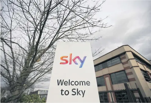  ?? AFP ?? This file photo shows a Sky logo next to the entrance to pay-TV giant Sky Plc’s headquarte­rs in Isleworth, London.