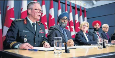  ?? CP PHOTO ?? General Jonathan Vance, Chief of the Defence Staff, from left, Defence Minister Harjit Sajjan, Carla Qualtrough, Minister of Public Services and Procuremen­t, Navdeep Bains, Minister of Innovation, Science and Economic Developmen­t and Marc Garneau,...