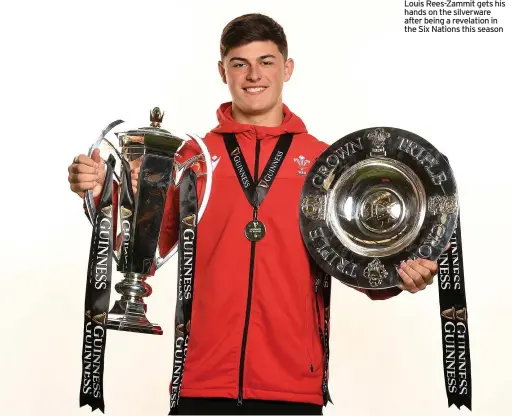  ??  ?? Louis Rees-Zammit gets his hands on the silverware after being a revelation in the Six Nations this season