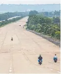  ??  ?? Roads in Naypyidaw swell to 16 lanes in places, but there is almost no traffic.