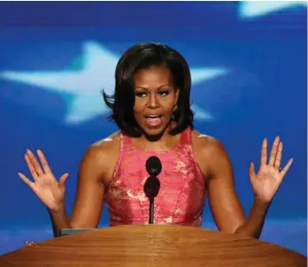 ?? ALEX WONG/GETTY IMAGES FILE PHOTO ?? Former first lady Michelle Obama still sets the gold standard when it comes to the toned, buffed arms we’d all like.