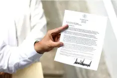  ??  ?? Marcelo Ebrard, picked by Mexico’s president-elect Andres Manuel Lopez Obrador as foreign minister, shows the letter sent by US President Donald Trump during a news conference at his campaign headquarte­rs in Mexico City, Mexico July 24. — Reuters photo