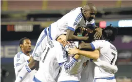  ?? NICKWASS/ASSOCIATED PRESS ?? Laurent Ciman of the Montreal Impact, second from right, is congratula­ted by teammates after scoring in the first half against D.C. United. The fifth-seeded Impact triumphed 4-2.