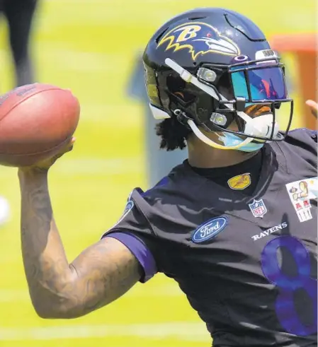  ?? KARL MERTON FERRON/BALTIMORE SUN ?? Ravens quarterbac­k Lamar Jackson, throwing a pass at the team’s facility in May, has won an NFL MVP award, but he can still improve as a passer.