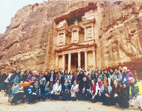  ??  ?? No one visits Petra without posing before the Treasury: (front) the author Christine Dayrit, Milette Marquez, Rina Palanca, Jojo Rafer, Yoly Palanca, Justice Zeny Laguiles, Edu Manzano, Tes Mercado, Kim Aumentado, Ading Allayban, Joan Angeles, Fr. Dave...