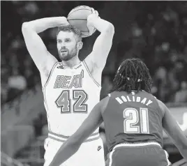  ?? JEFF HANISCH Jeff Hanisch-USA TODAY Sports ?? Kevin Love was scoreless in his Heat debut on Friday, but he had eight rebounds, four assists and no turnovers. ‘I’m just trying to make the game easier for other guys,’ he said.