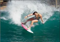  ?? (AP/Gary Kazanjian) ?? Moore works out on a Surf Ranch wave June 15 in Lemoore.