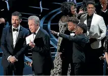  ?? REUTERS ?? Warren Beatty, front, during that infamous moment at this year’s Oscars, when the wrong best picture winner was announced.