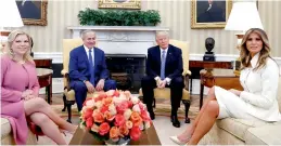  ?? PTI ?? President Donald Trump and Israeli Prime Minister Benjamin Netanyahu, joined by their wives first lady Melania Trump, right, and Sara Netanyahu, left, at the Oval Office of the White House in Washington on Thursday. —