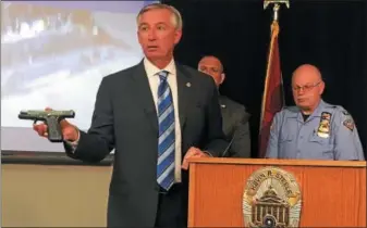  ?? CARL HESSLER JR. — DIGITAL FIRST MEDIA ?? Montgomery County District Attorney Kevin R. Steele displays the guns that authoritie­s seized during “Operation Poison Control,” the investigat­ion that dismantled a drug traffickin­g network distributi­ng fentanyl and cocaine.