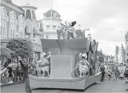  ?? TED SHAFFREY AP ?? Central Florida’s branding plan is aimed at tourists, meeting planners, convention­eers, business relocation specialist­s, site selectors, business owners and company CEOs. Pictured: a float at Magic Kingdom Park at Walt Disney World Resort.