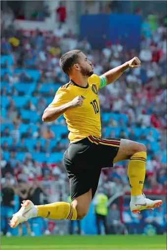  ?? HASSAN AMMAR/AP PHOTO ?? Belgium’s Eden Hazard celebrates after converting a penalty kick for Belgium’s first goal during Saturday’s 5-2 victory over Tunisia in a World Cup Group B match in Moscow.