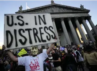  ?? EMMANUEL DUNAND/AFP/GETTY IMAGES FILE PHOTO ?? Union members and Occupy Wall Street demonstrat­ors protest bank bailouts, foreclosur­es and high unemployme­nt near Wall Street in New York in the fall of 2011.