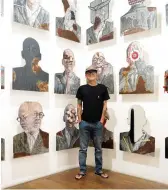  ?? ?? Left to Right The installati­on view of "Agus Suwage: The Theatre of Me"; Agus Suwage in front of his work 'Potret Diri dan Panggung Sandiwara'