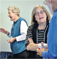  ??  ?? Opposing Republican­s and Democrats discuss their difference­s at a Better Angels meeting in Frederick, Maryland