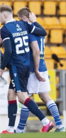  ??  ?? St Johnstone congratula­te each other at full time after sealing their place in the top half of the Premiershi­p