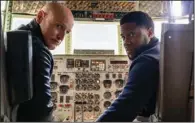  ?? ?? The most dangerous game: A terrifying assassin/torturer (Woody Harrelson) meets and co-opts his impostor, a suburban husband named Teddy (Kevin Hart), in Netflix’s allegedly funny thriller “The Man From Toronto.”
