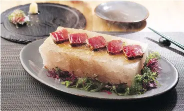  ??  ?? The togarashi spiced bluefin tuna on a Himalayan salt block with ponzu daikon sauce is a big seller as well.