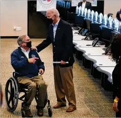  ?? PATRICK SEMANSKY/AP ?? President Joe Biden tours the Harris County Emergency Operations Center with Texas Gov. Greg Abbott on Friday in Houston during his visit to survey winter storm damage to the hard-hit region.